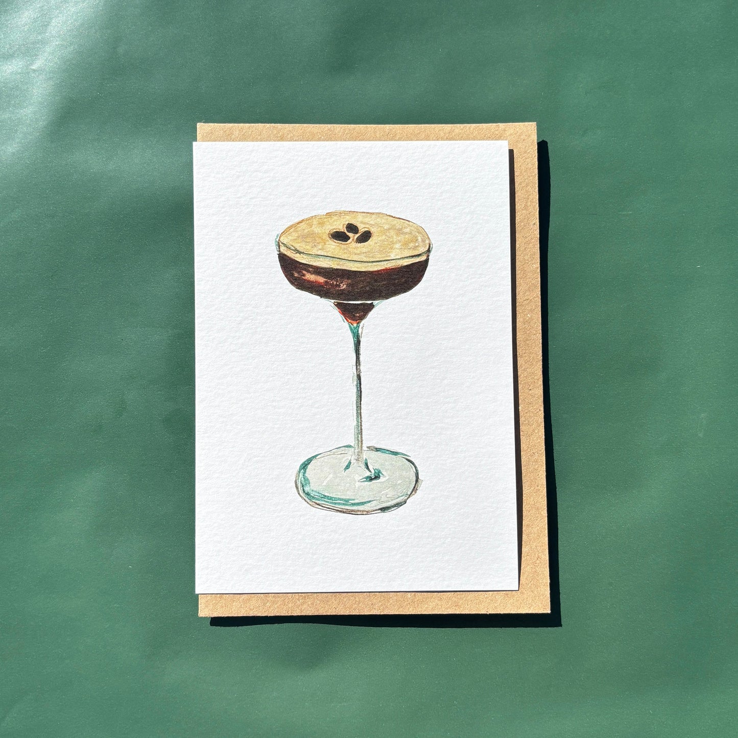 A greeting card featuring an illustration of an espresso martini cocktail