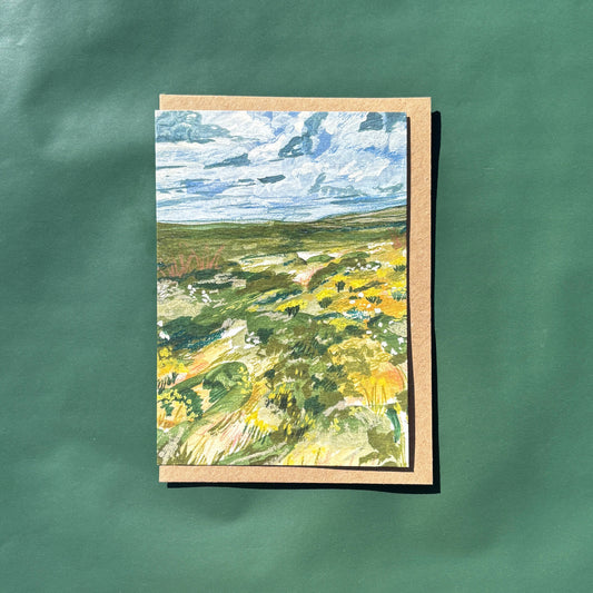 A greeting card featuring a painting of an irish forest landscape