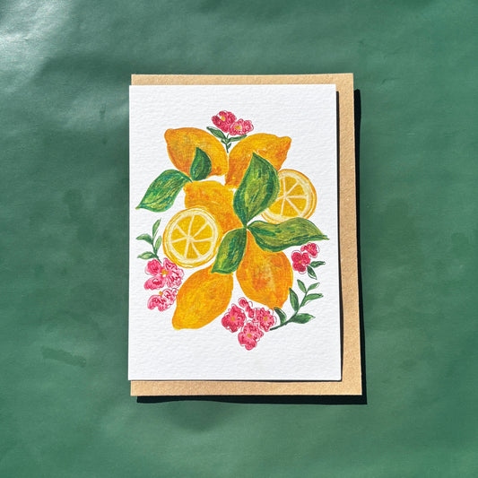 Greeting card featuring an illustration of lemons and flowers