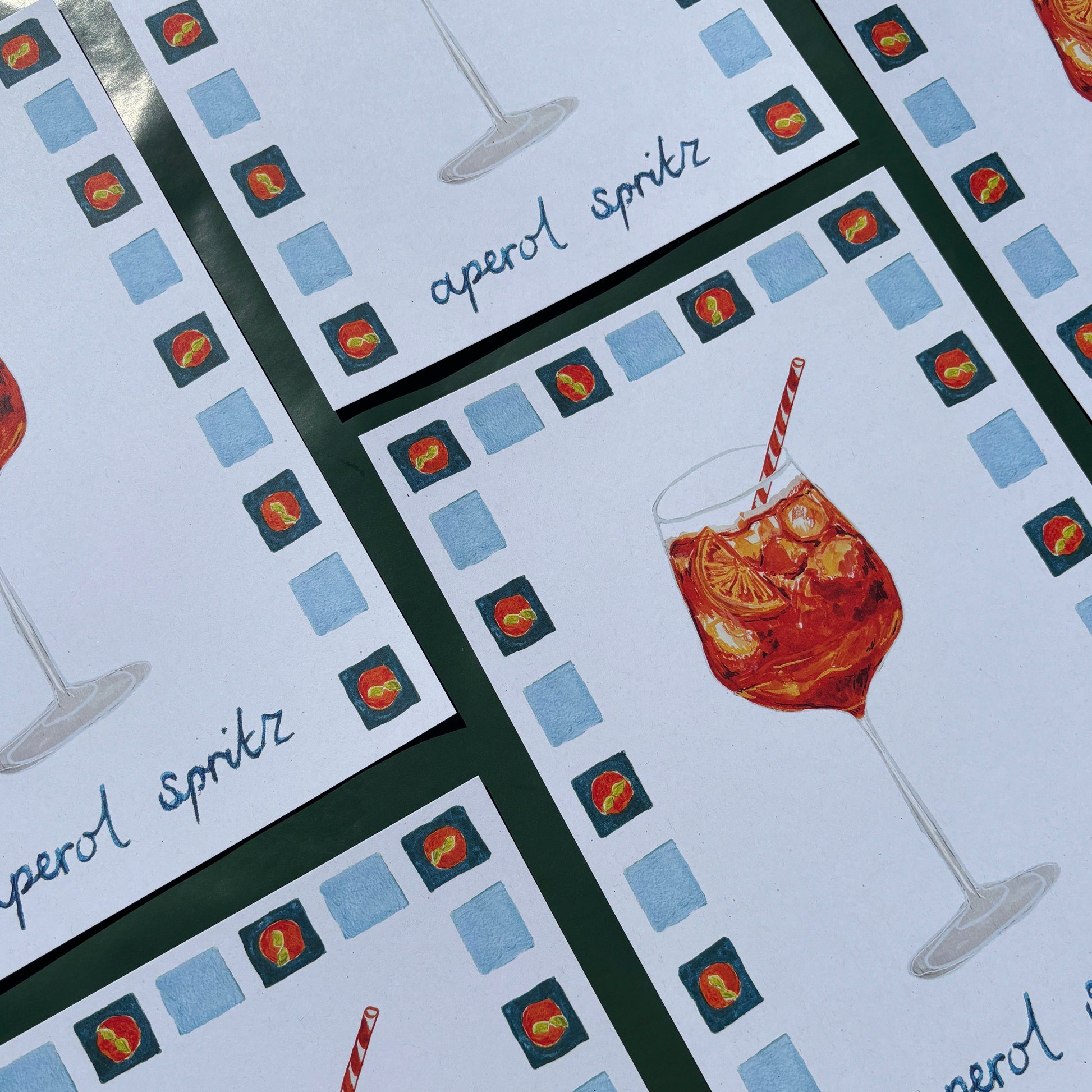 Prints with aperol spritz illustrations and text with a checkered border