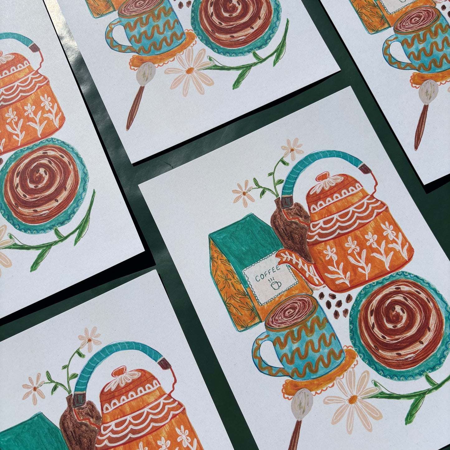 Set of illustrated prints featuring coffee-themed designs with mugs, cakes, and flowers.