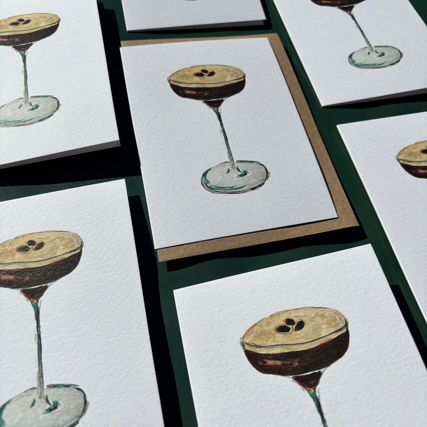 Multiple greeting cards featuring espresso martini illustrations