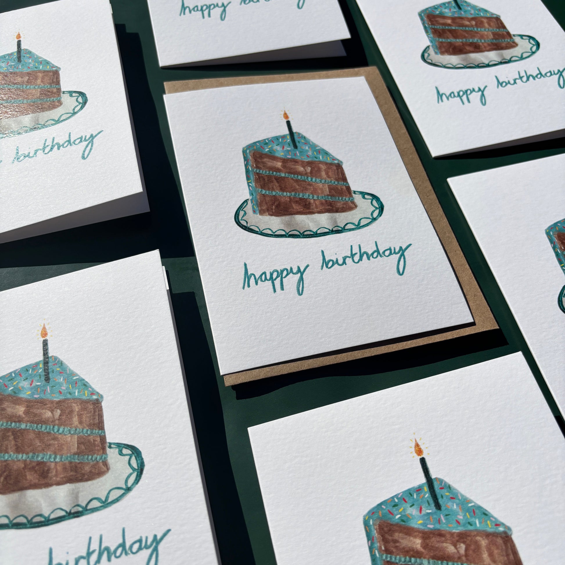 Multiple greeting cards featuring a birthday cake illustration and 'happy birthday' text.
