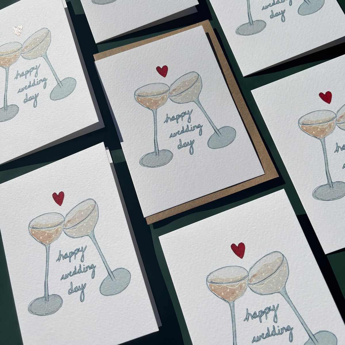 Set of greeting cards with illustrations of champagne glasses and 'happy wedding day' text