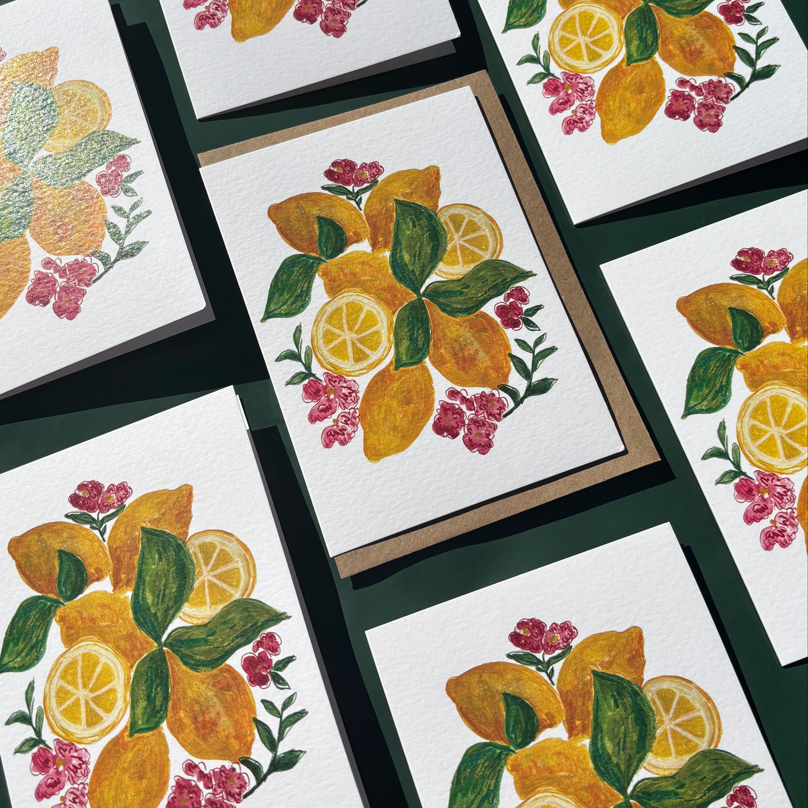 Multiple greeting cards with lemons and flower illustrations.